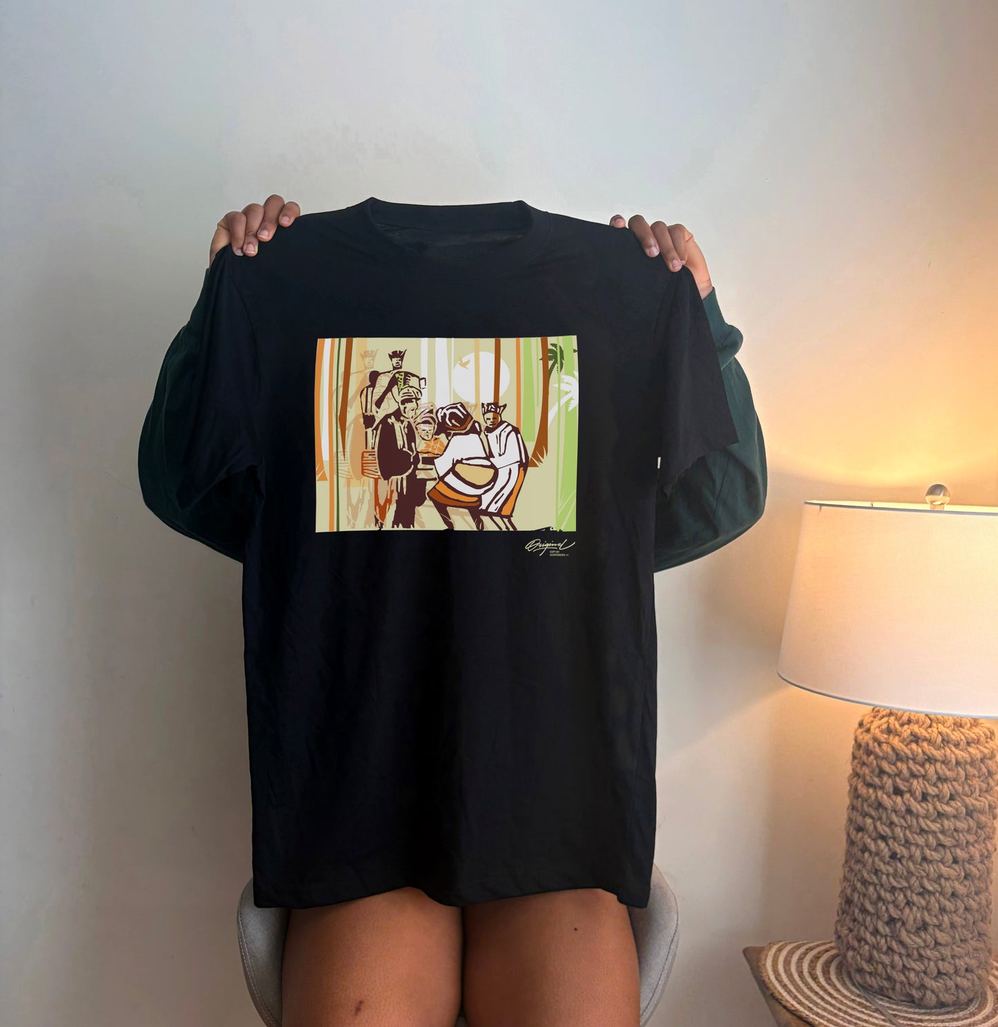 Black Cultural Heritage Graphic T-Shirt featuring artistic heritage-inspired illustration on premium cotton fabric.