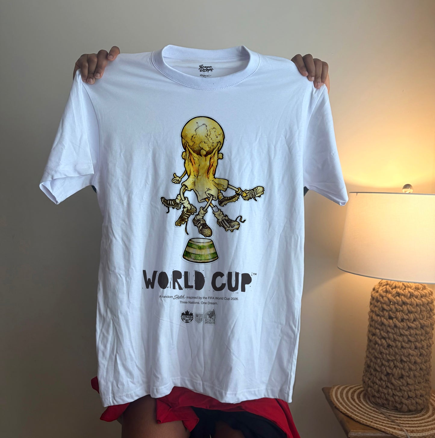 White 2026 World Cup graphic t-shirt with unique football-inspired artwork for soccer supporters.