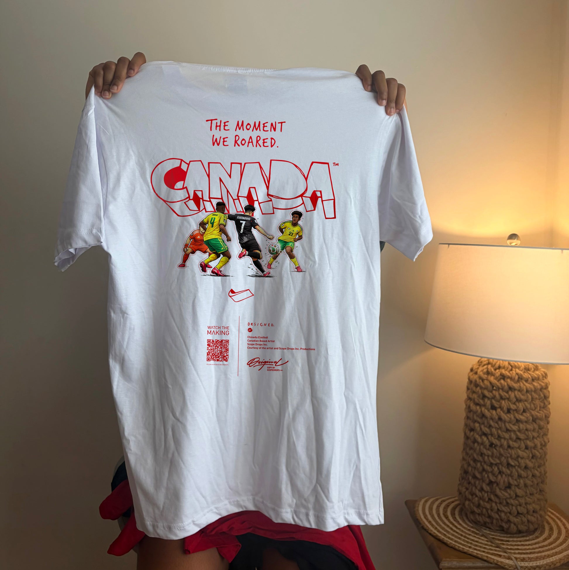 Back view of The Moment We Roared Canada Soccer graphic t-shirt with premium artwork for Canadian football supporters